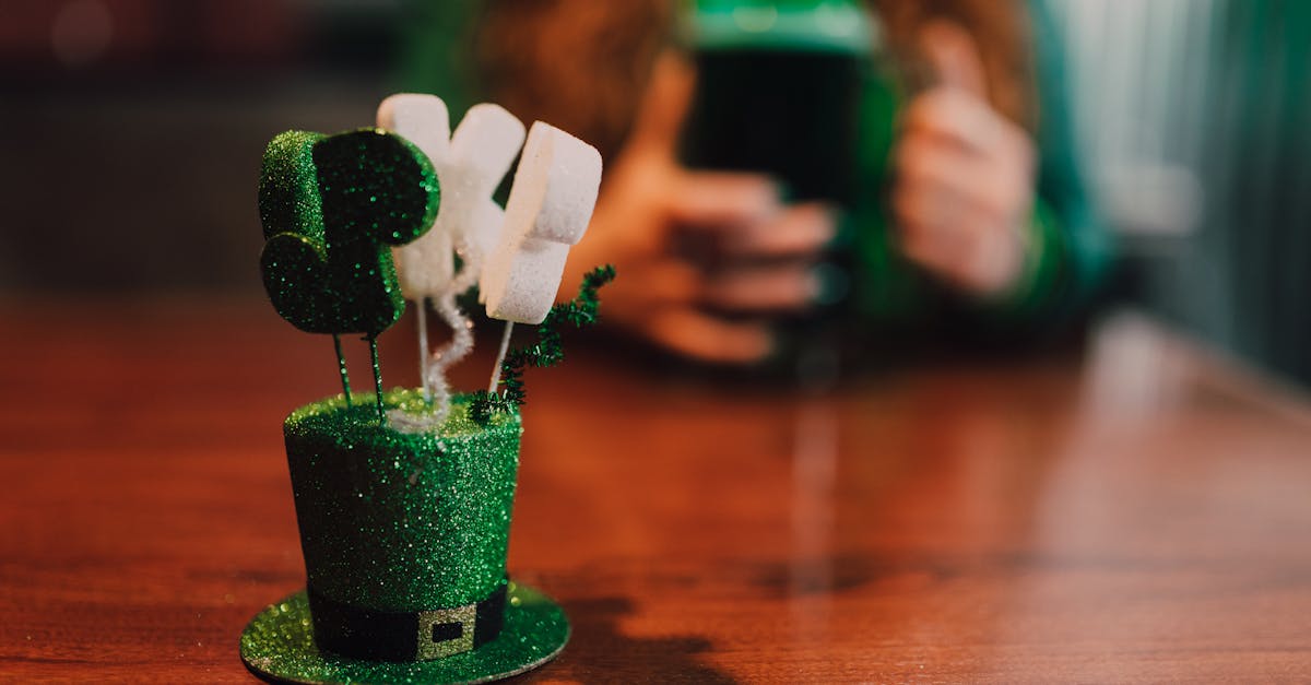 close up of st patrick s day decor with a green beer in the background celebrating the holiday spi