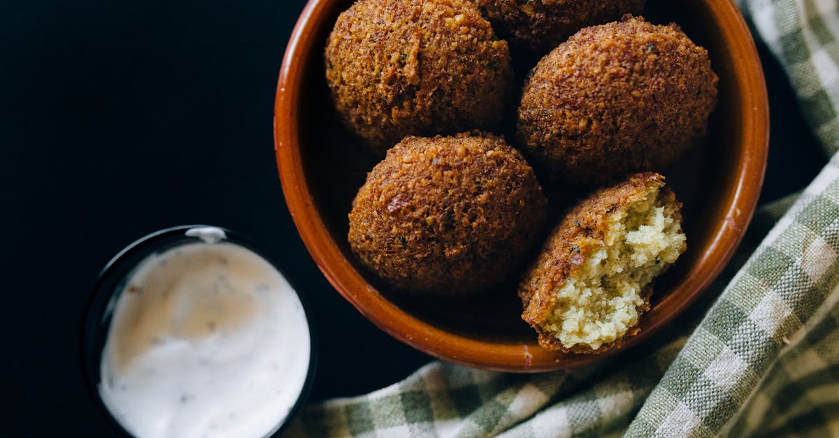 close up shot of crispy falafel balls served with creamy tahini sauce in an inviting setting 2