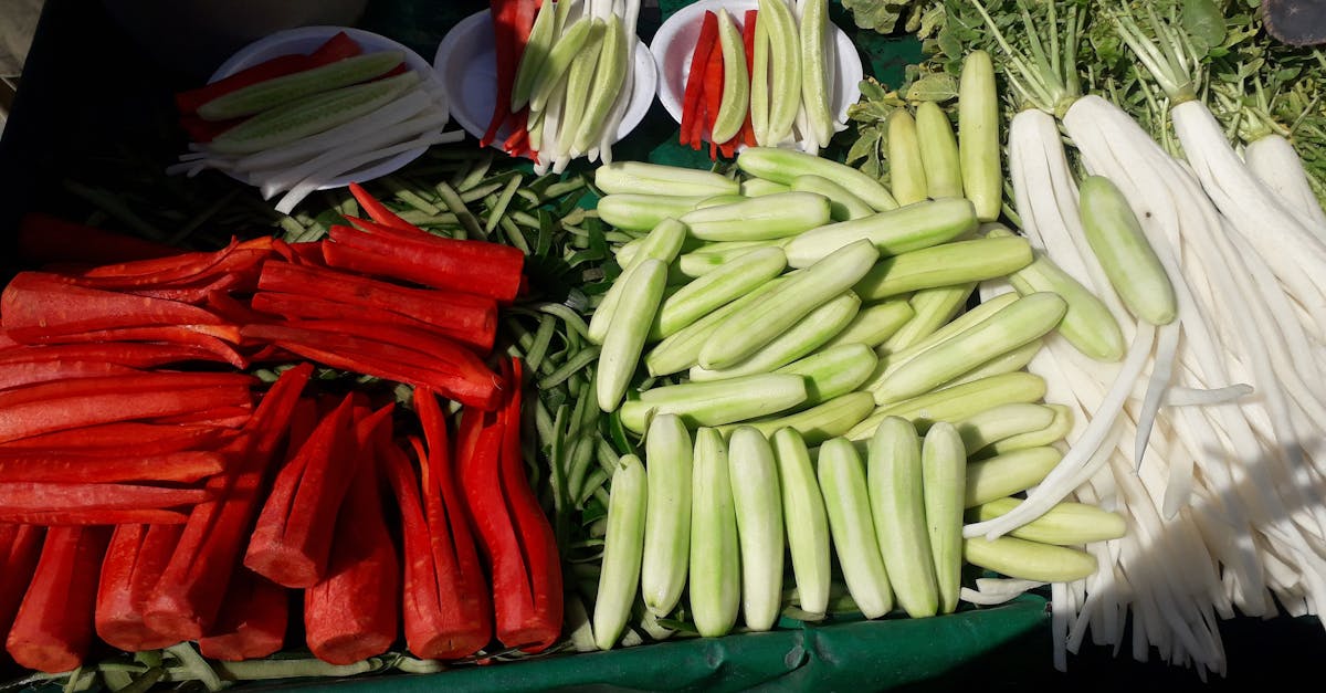 colorful display of fresh vegetables including cucumbers radishes and carrots at an outdoor market 4