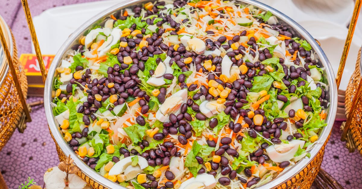 colorful salad with black beans corn and cabbage mix in a decorative brass bowl