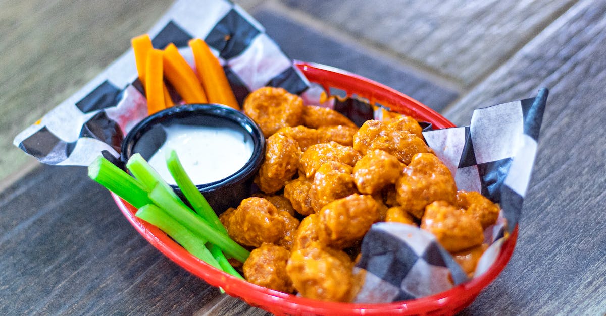 crispy buffalo cauliflower paired with carrots celery and ranch dip in a vibrant basket 3