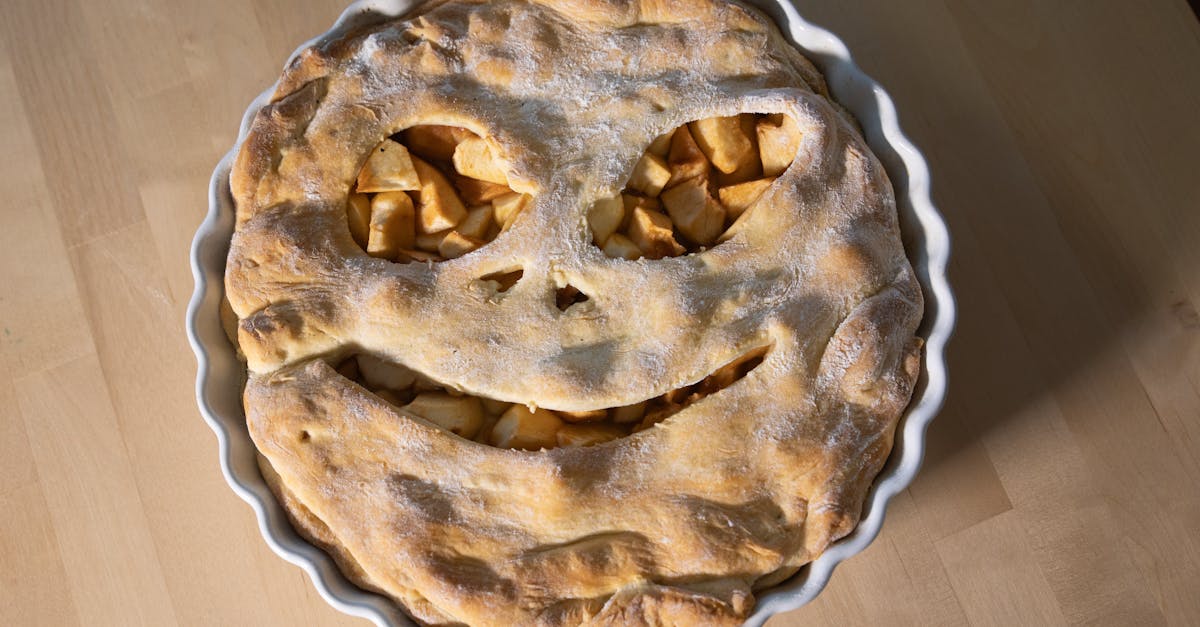 Home delicious apple pie with a smiley face design perfect for festive occasions 1