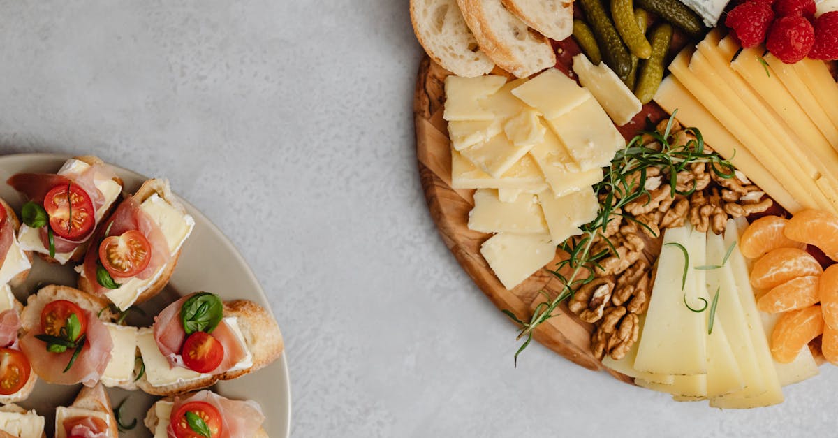 delicious assortment of cheeses meats fruits and nuts on a charcuterie board