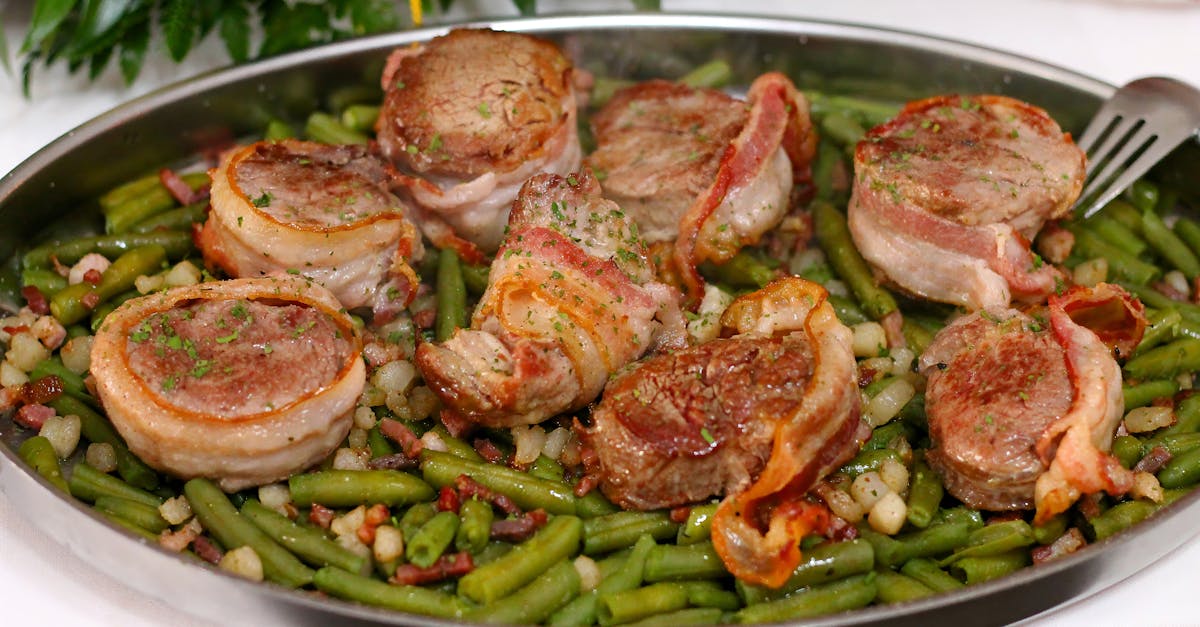 delicious bacon wrapped pork medallions served on a bed of seasoned green beans and beans 2