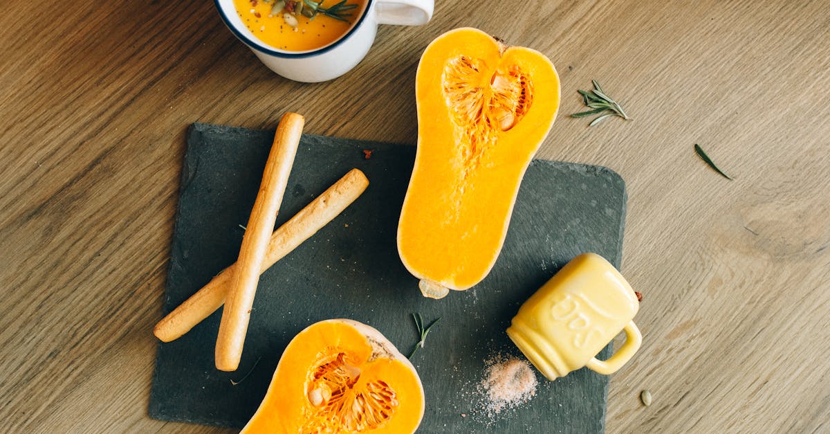 delicious butternut squash soup with breadsticks on a rustic cutting board perfect for fall cuisine 9