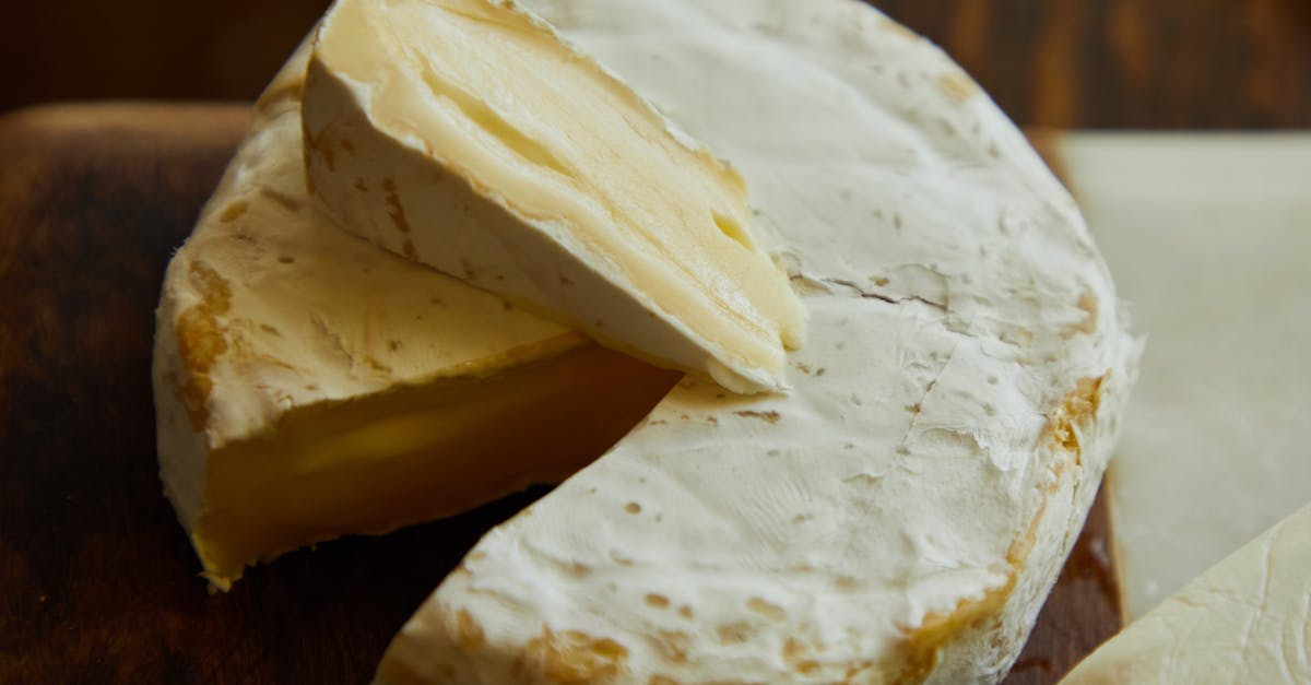 delicious camembert cheese wheel and slice showing creamy texture 5