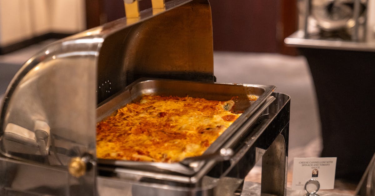 delicious cheese cannelloni in buffet tray with display card