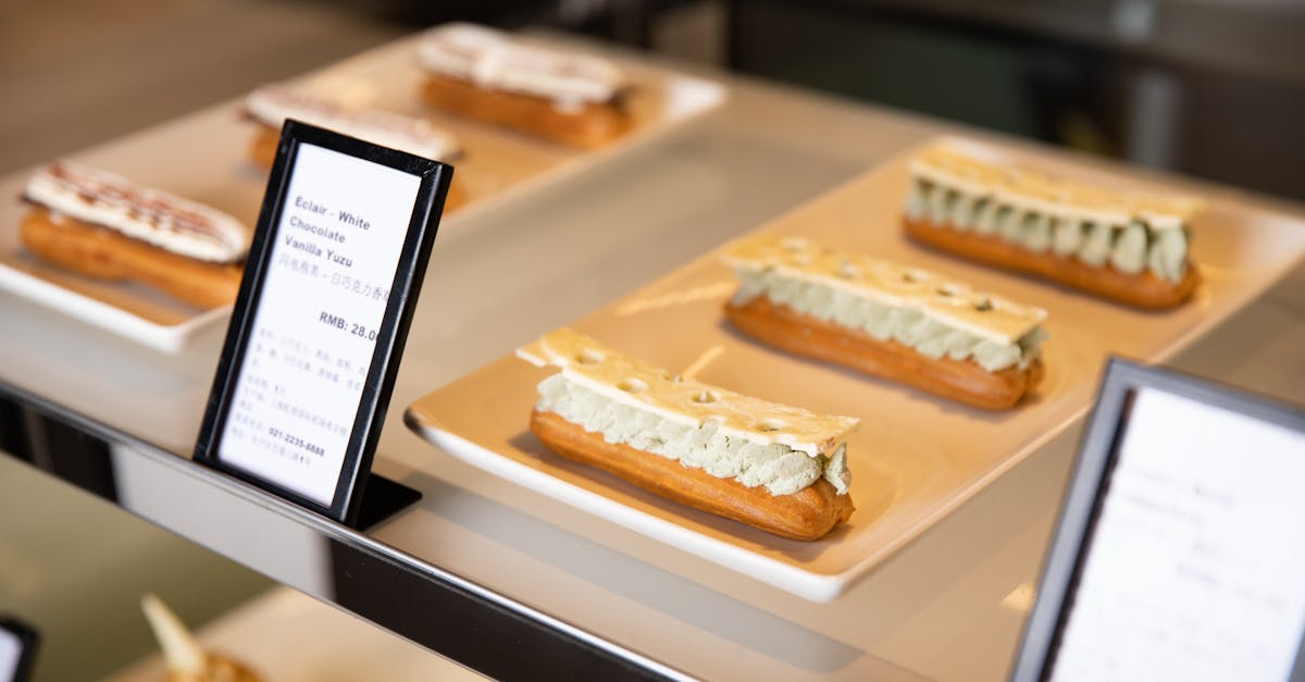 delicious eclairs with white chocolate and yuzu cream displayed elegantly on plates