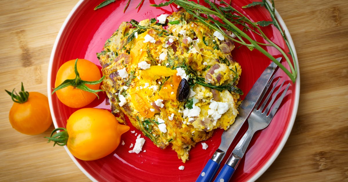 delicious greek frittata with tomatoes and feta on a vibrant red plate 3
