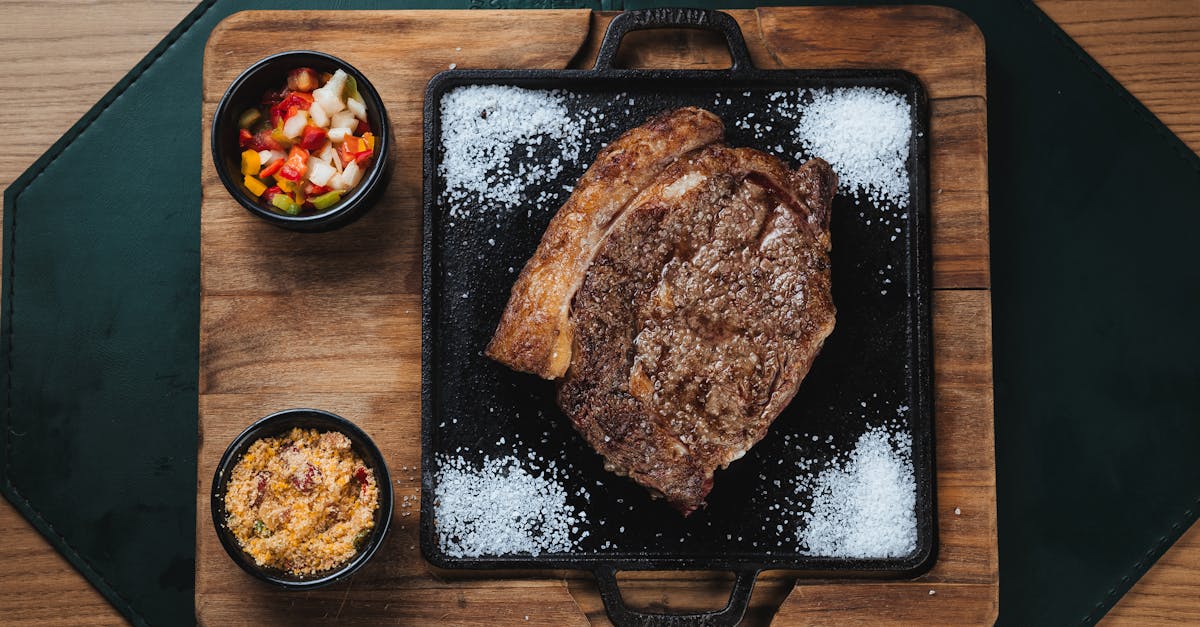 delicious grilled ribeye steak with colorful salsa and farofa served on a wooden board