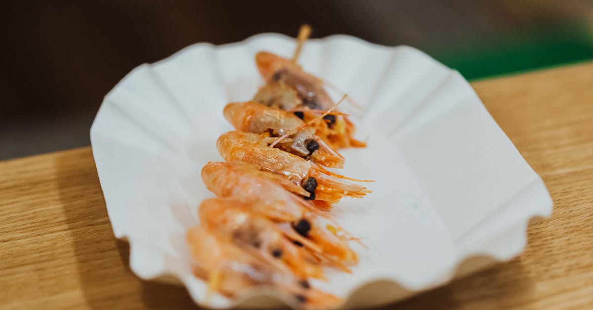 delicious grilled shrimp skewers served on a stylish white plate perfect for seafood lovers 1