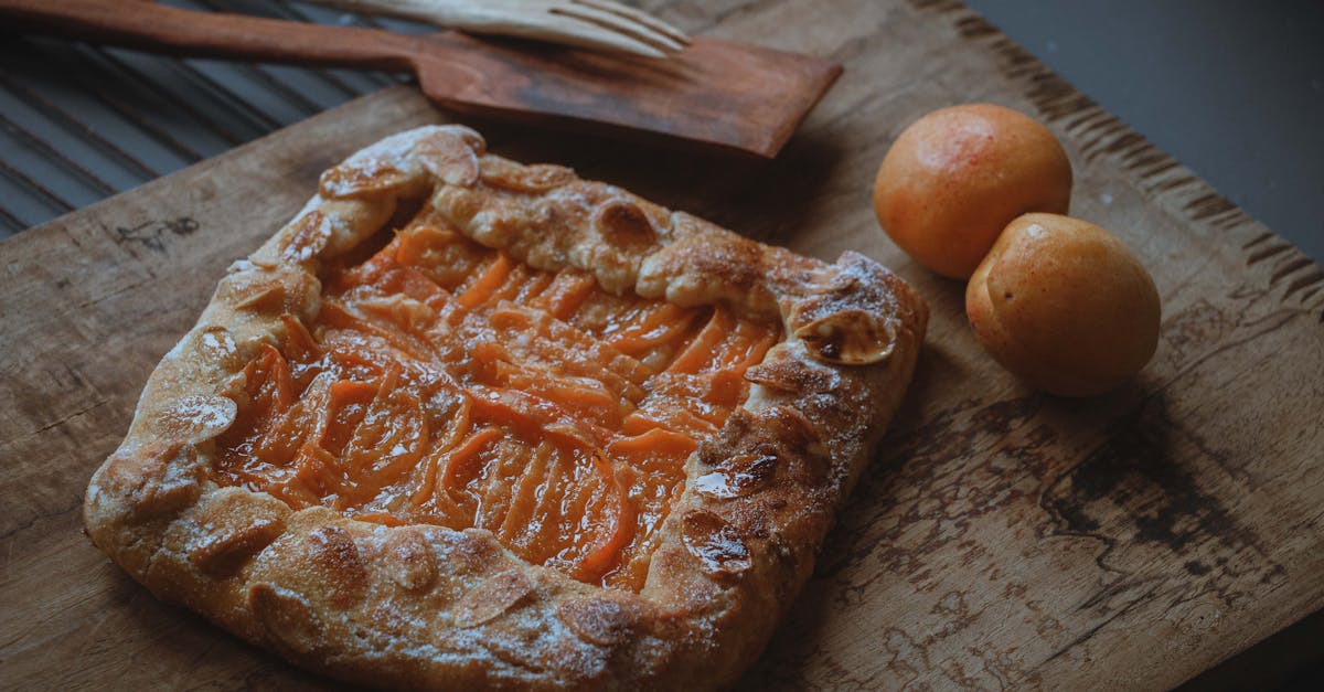 Home delicious homemade apricot galette on a rustic wooden board perfect for dessert lovers 1