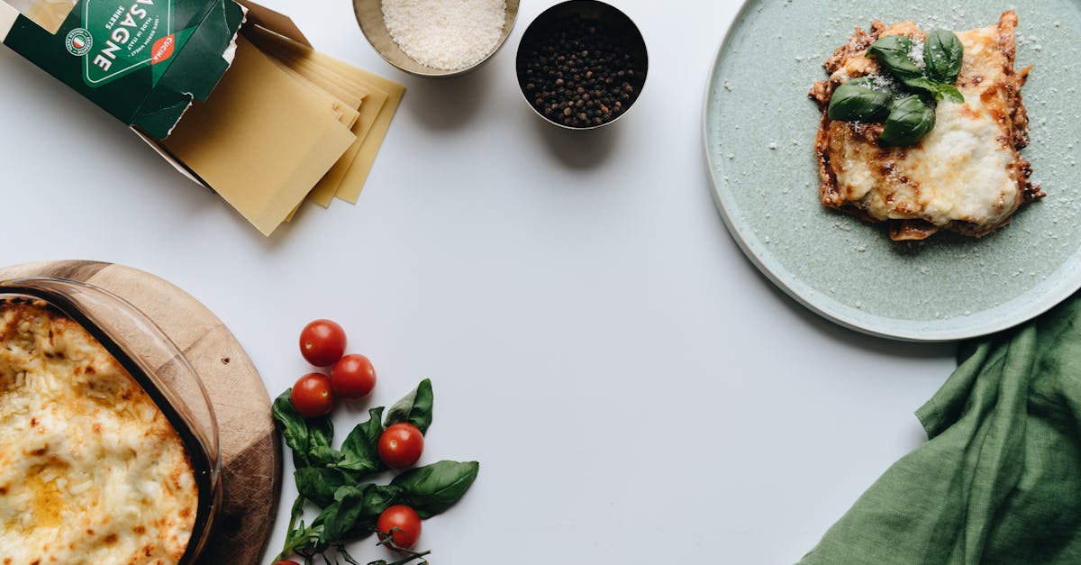 delicious homemade italian lasagna with fresh tomatoes and basil styled on a white background