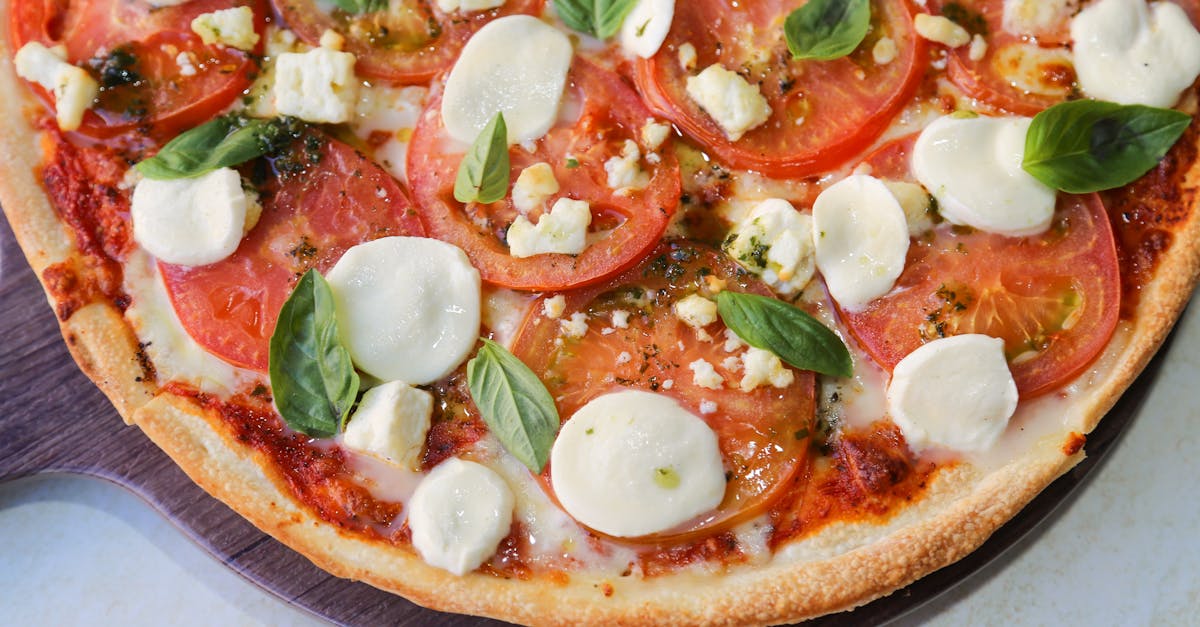 delicious homemade margherita pizza topped with fresh basil and mozzarella cheese
