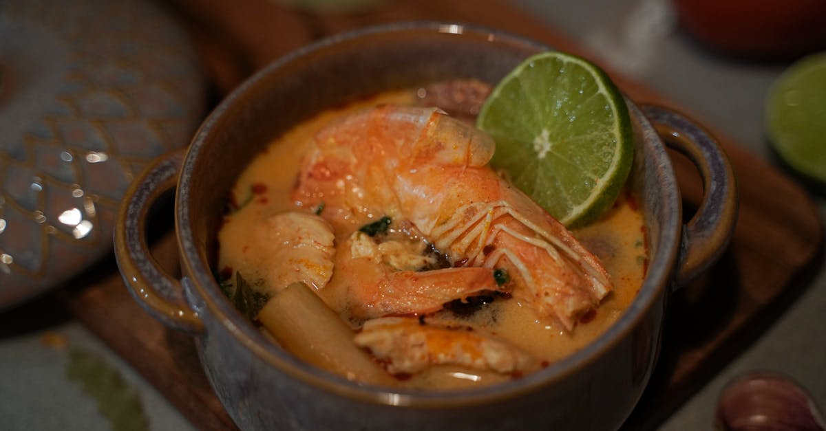delicious homemade thai tom yum soup featuring fresh shrimp and tangy lime in a ceramic bowl 1