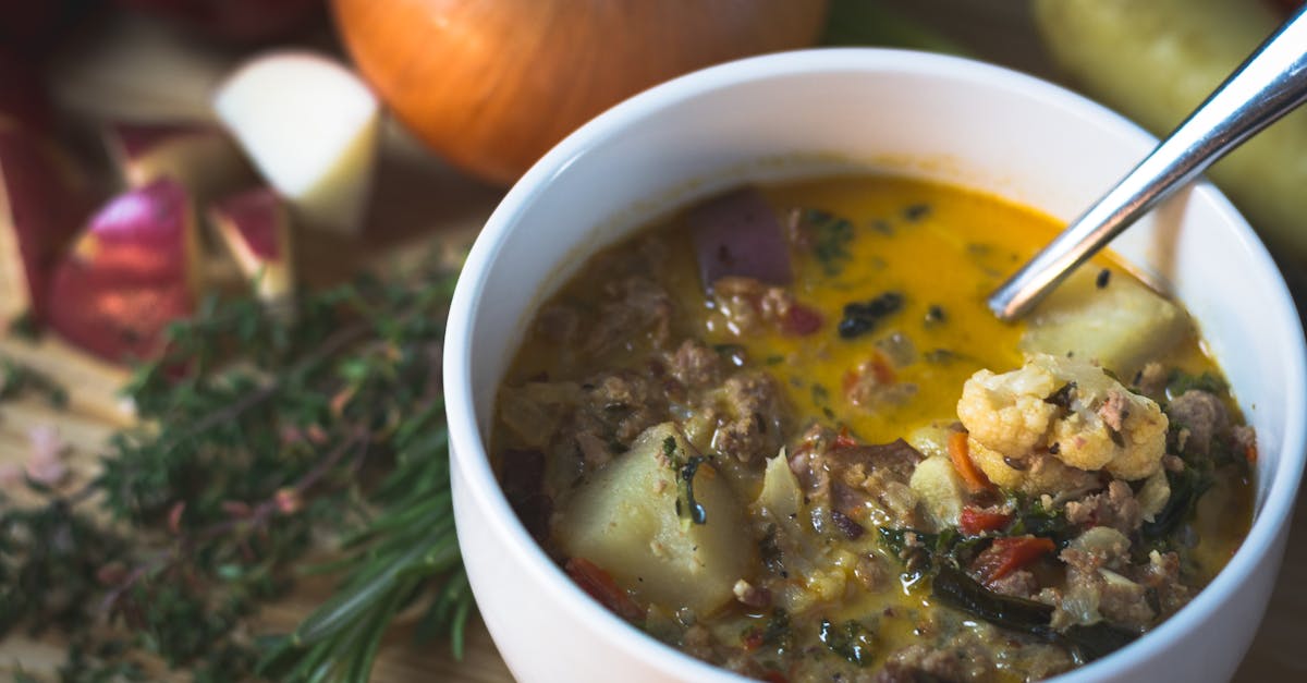 delicious homemade vegetable soup with fresh ingredients in a white bowl