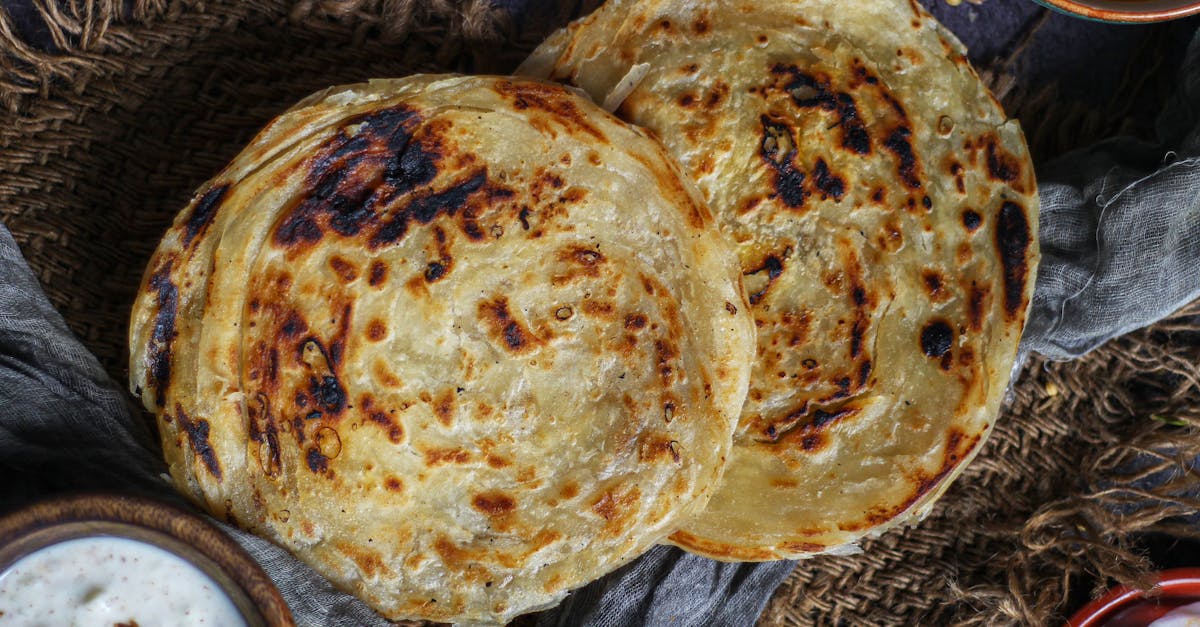delicious indian parotta served with side dishes highlighting traditional flavors and