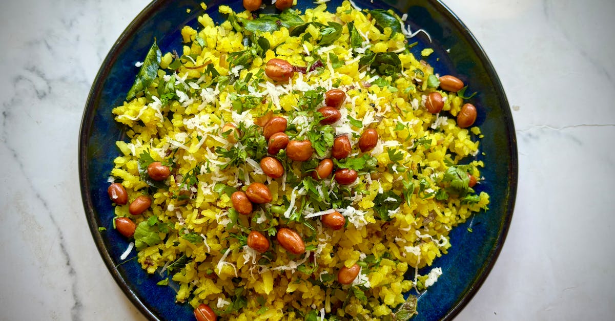 delicious indian poha with peanuts and herbs on a vibrant plate
