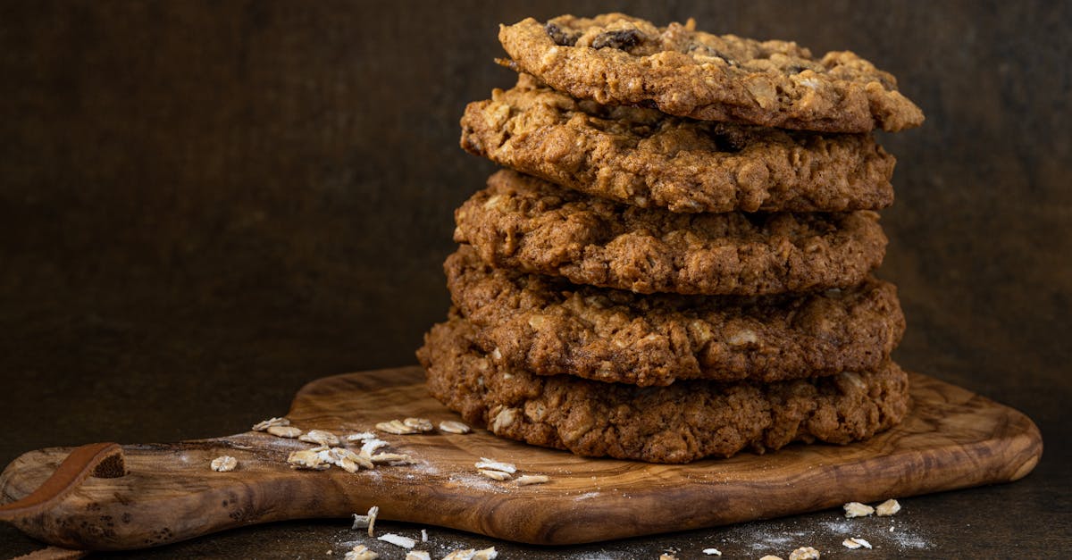 delicious oatmeal raisin cookies stacked on a wooden board perfect for dessert lovers
