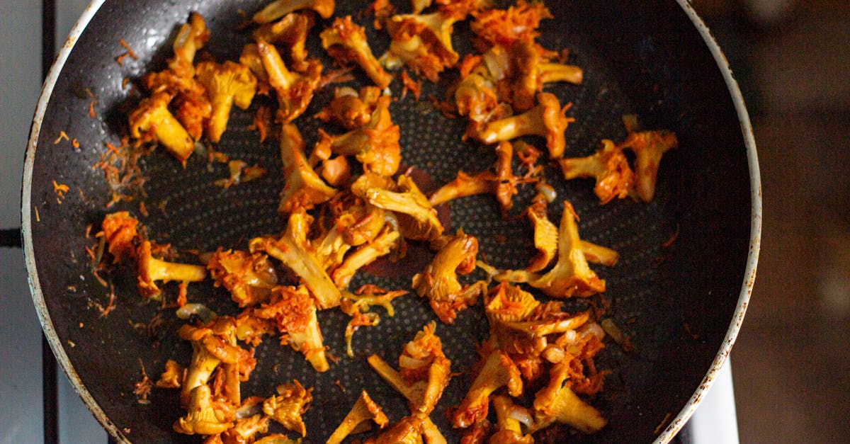 delicious sauteed chanterelle mushrooms cooking in a frying pan perfect for a gourmet meal 4