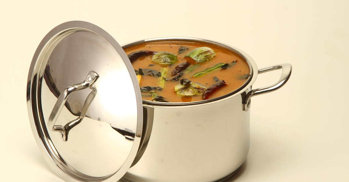 delicious south indian sambar curry in a stainless steel pot with colorful vegetables