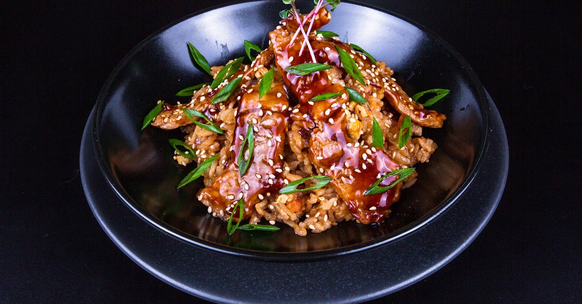 delicious spicy pork stir fry with vibrant vegetables and sesame seeds on rice perfect for a savory 2