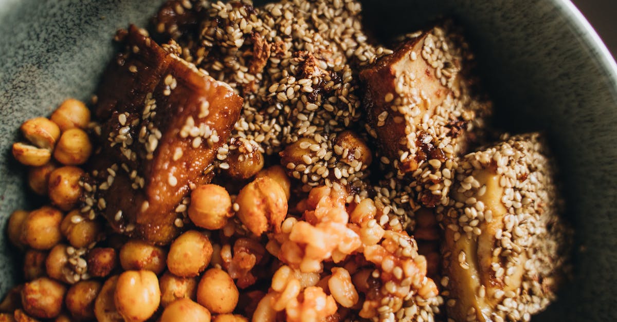 delicious vegan bowl featuring tofu chickpeas and sesame seeds for a nutritious meal
