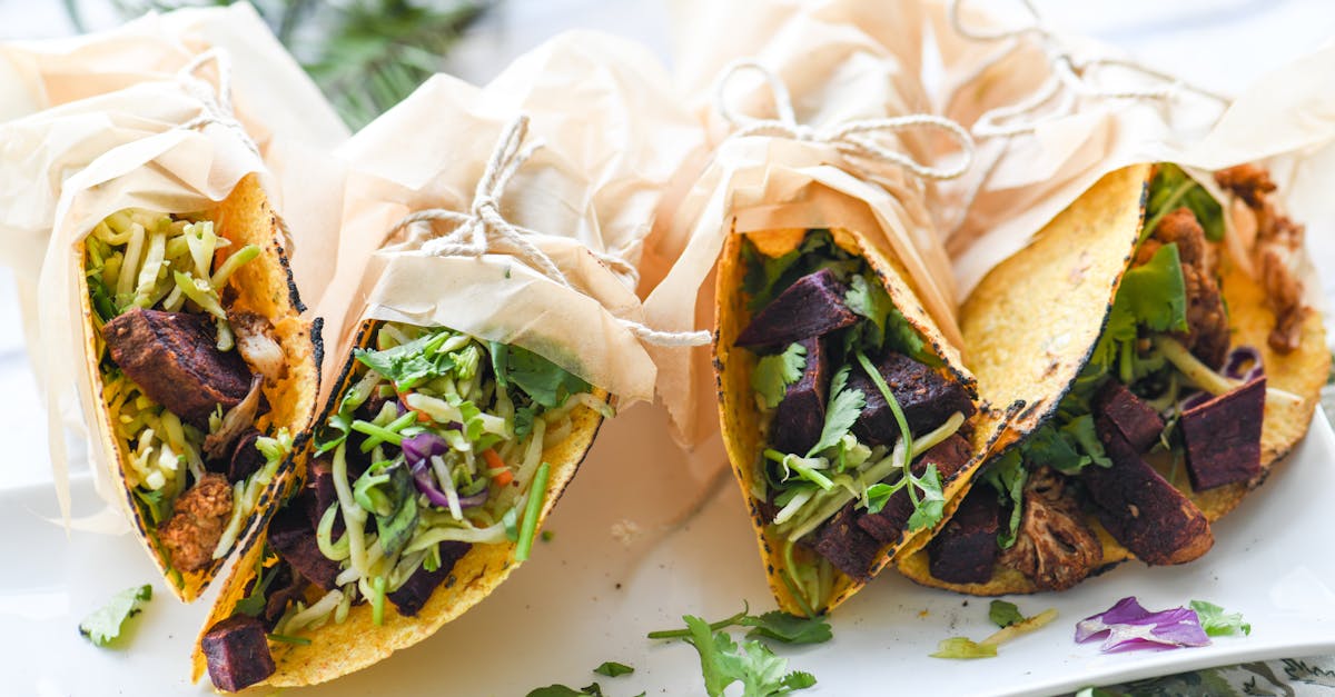 delicious vegetarian tacos filled with fresh vegetables and herbs wrapped in parchment paper