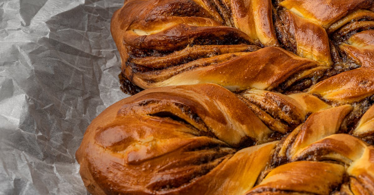 deliciously braided chocolate babka with a golden crust on parchment paper 2