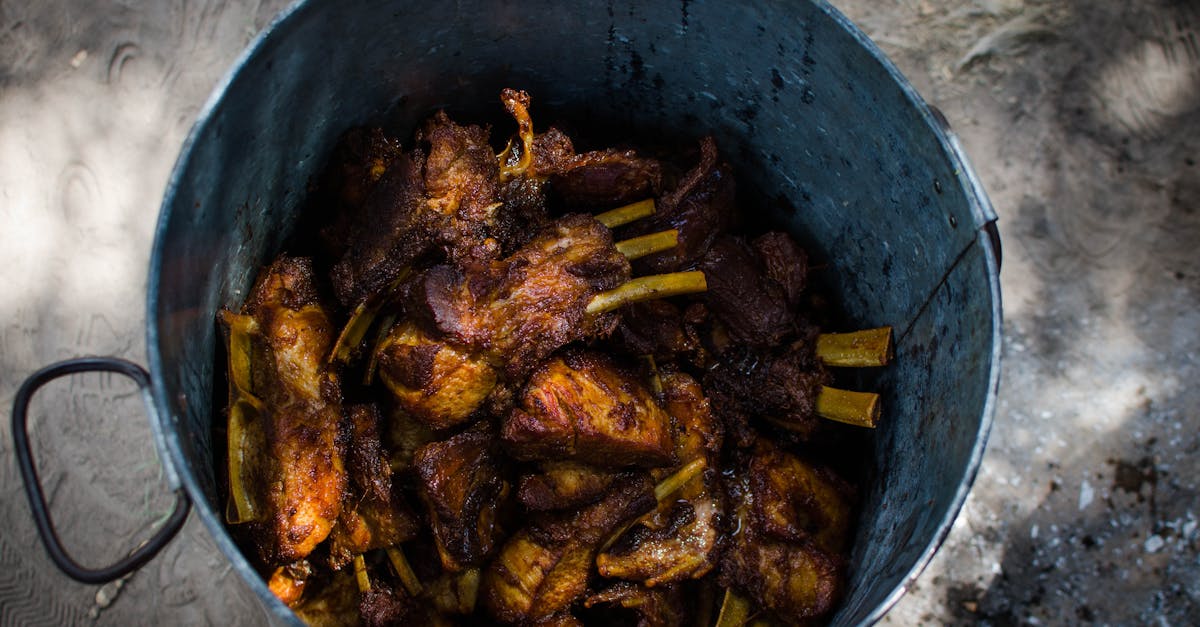 deliciously cooked pork ribs in a rustic metal pot perfect for a hearty meal 3