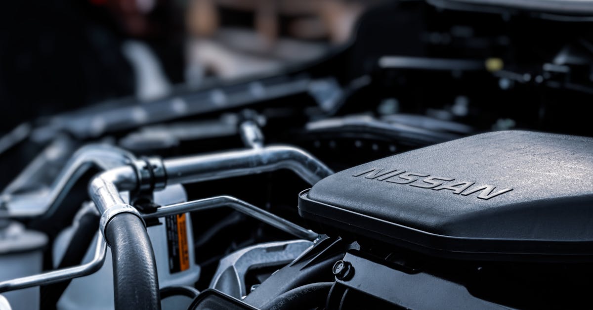 detailed view of a car engine compartment with visible nissan branding