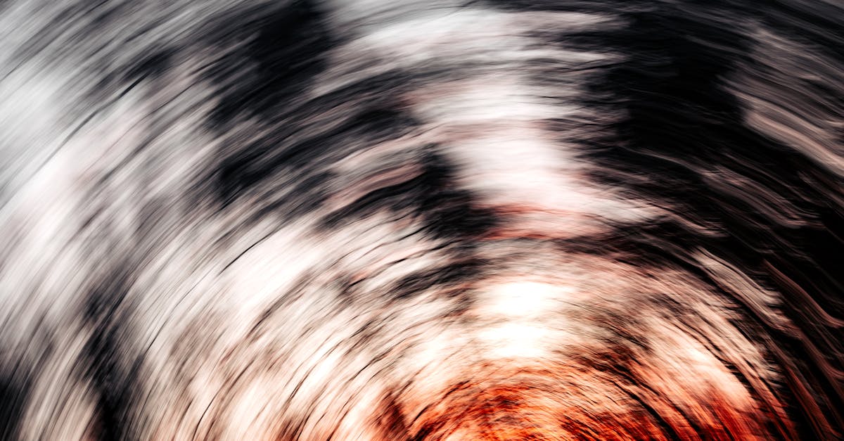 dynamic abstract image depicting swirling lines with fiery red and black textures creating a