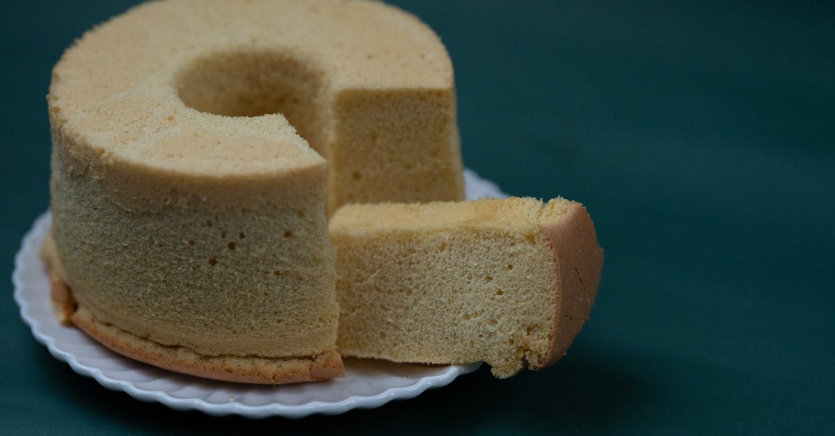 enjoy a slice of light and fluffy homemade sponge cake on a white plate
