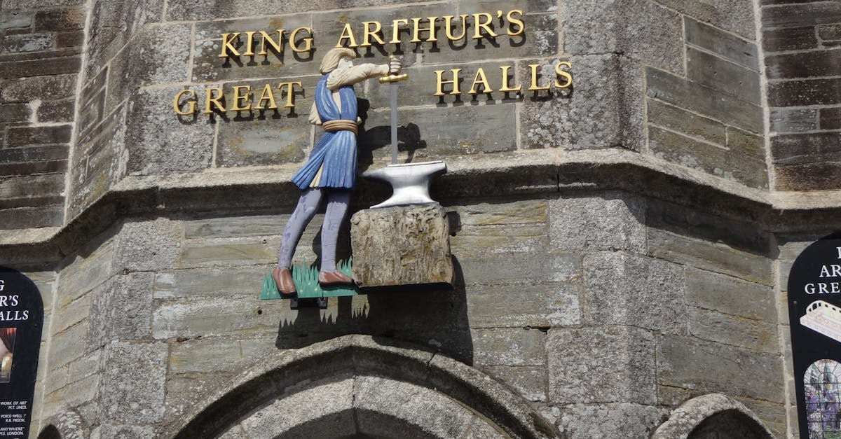 entrance to king arthur s great halls with knight statue and excalibur in tintagel england