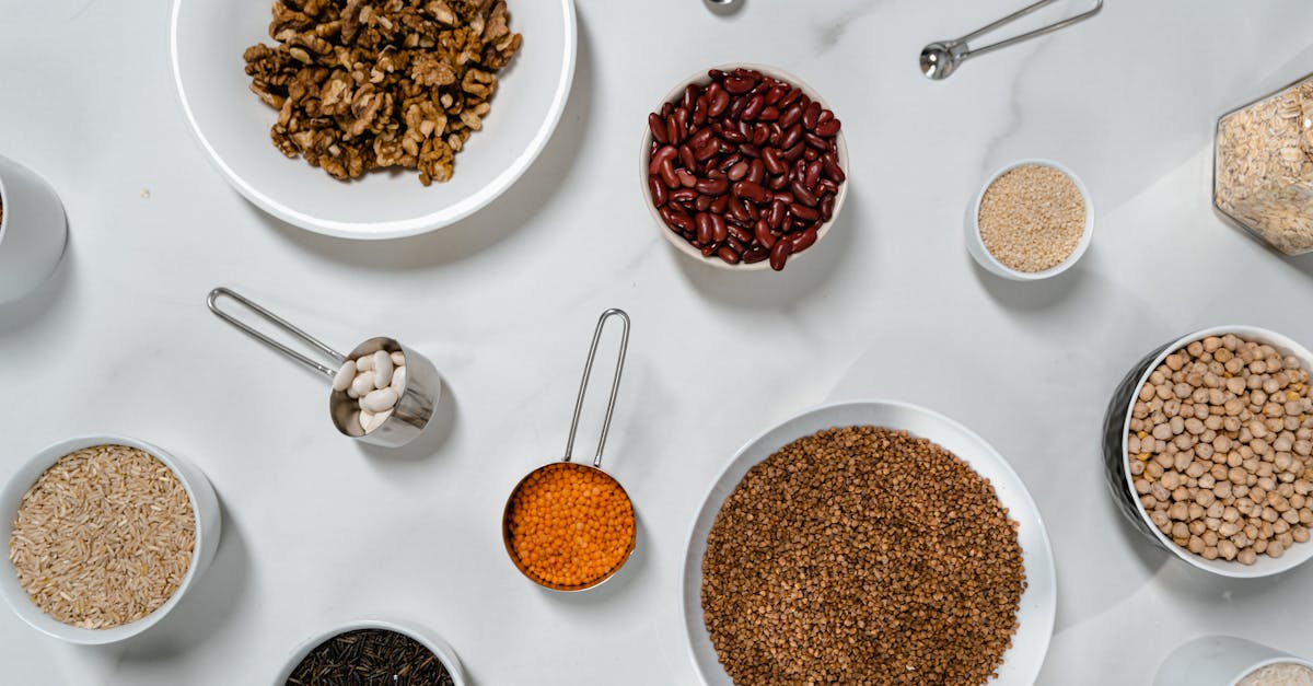 flat lay of nuts grains and beans artfully arranged on a marble countertop 1