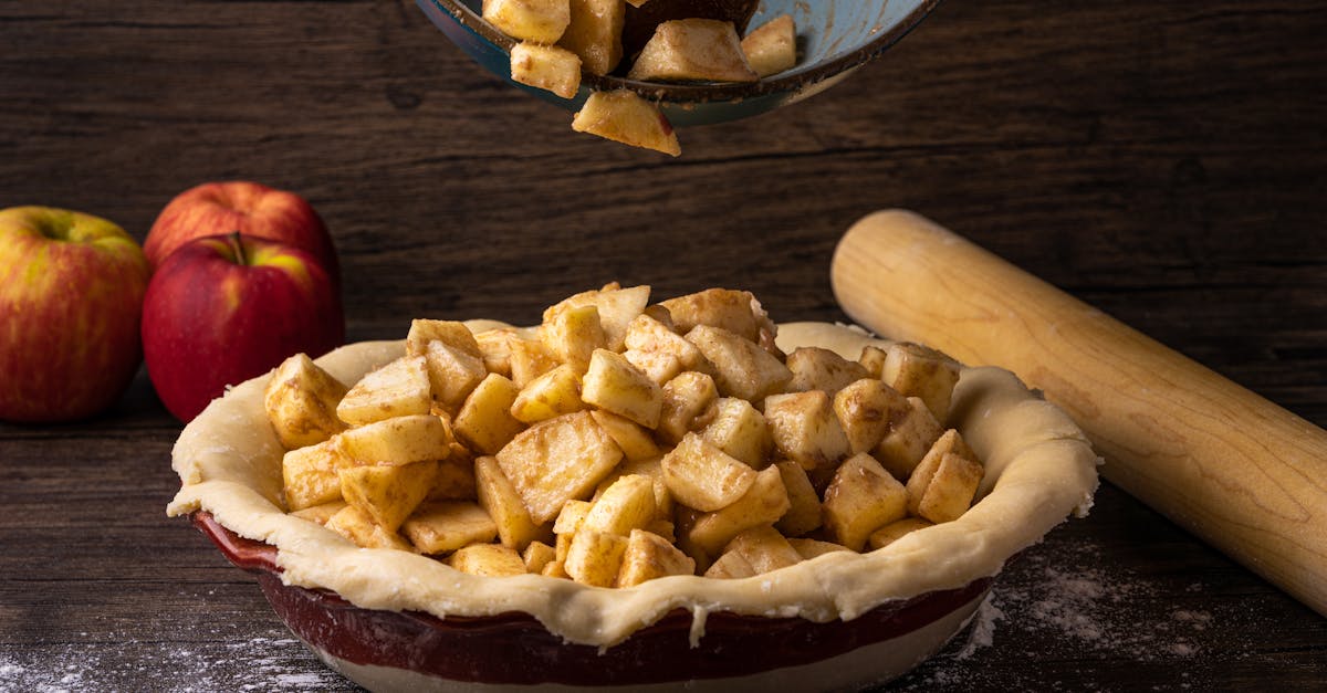 fresh apple pie preparation with cinnamon spiced apples in a dough crust ready for baking 1
