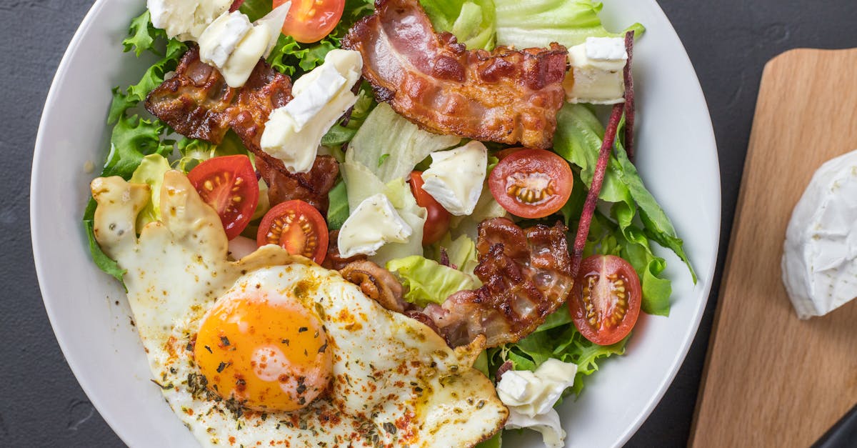 fresh ketogenic salad with bacon egg feta and tomatoes perfect for healthy eating
