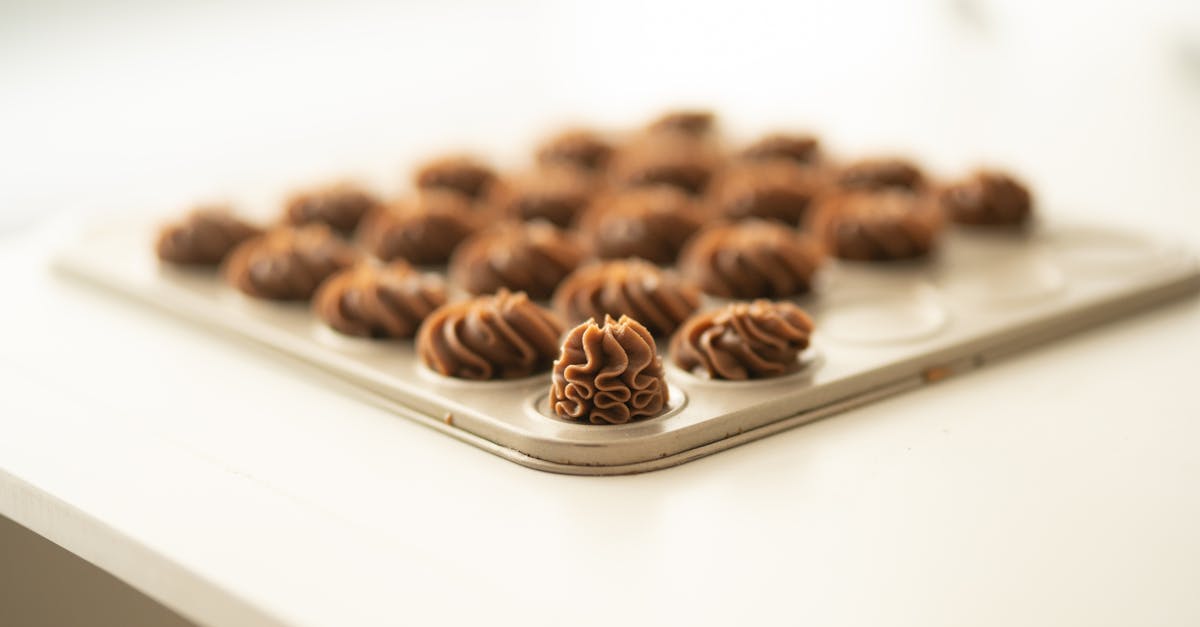 Home freshly baked chocolate meringue cookies displayed on a baking tray