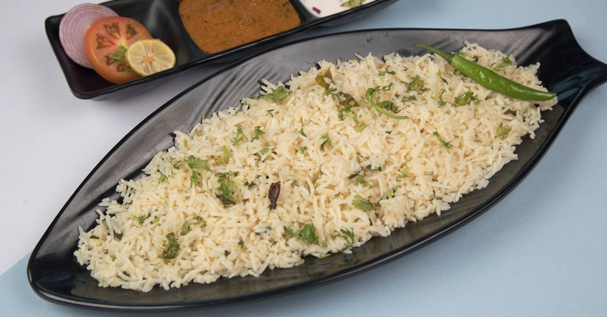 freshly prepared jeera rice served with chutney yogurt and salad 1