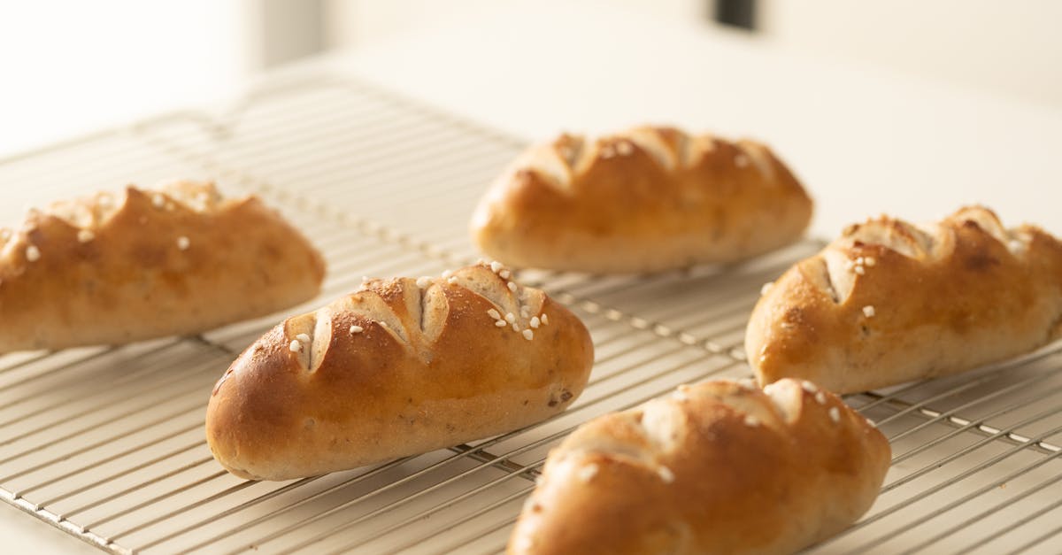 golden bread rolls cooling on a wire rack ready to enjoy 3