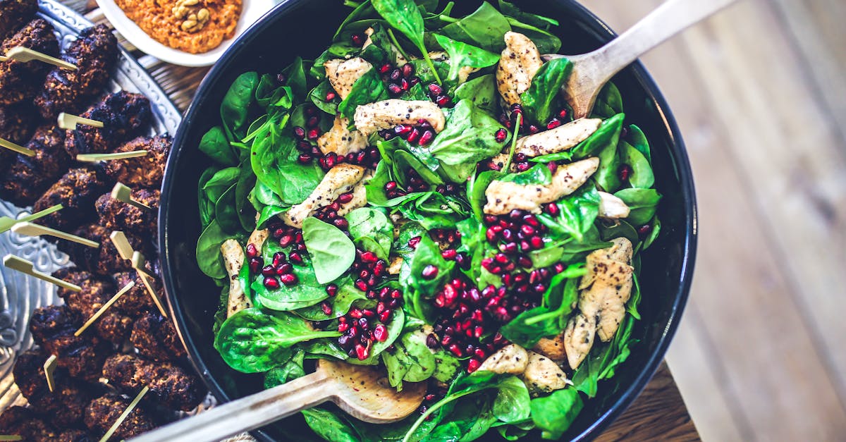 healthy and vibrant spinach salad with grilled chicken and pomegranate seeds perfect for a nutritio