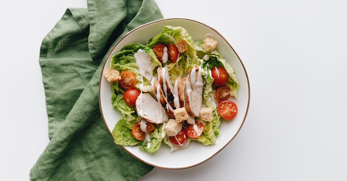 healthy caesar salad with grilled chicken croutons and cherry tomatoes in a bowl 3