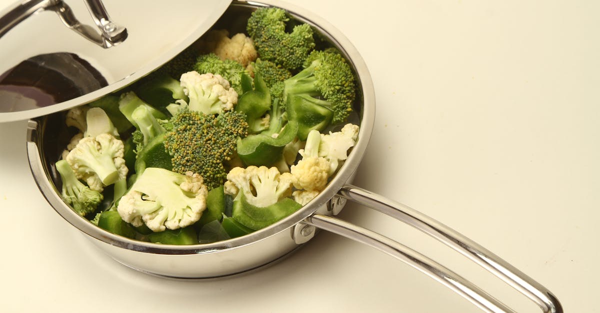 high angle view of broccoli and cauliflower in a stainless steel pan perfect for healthy cooking in