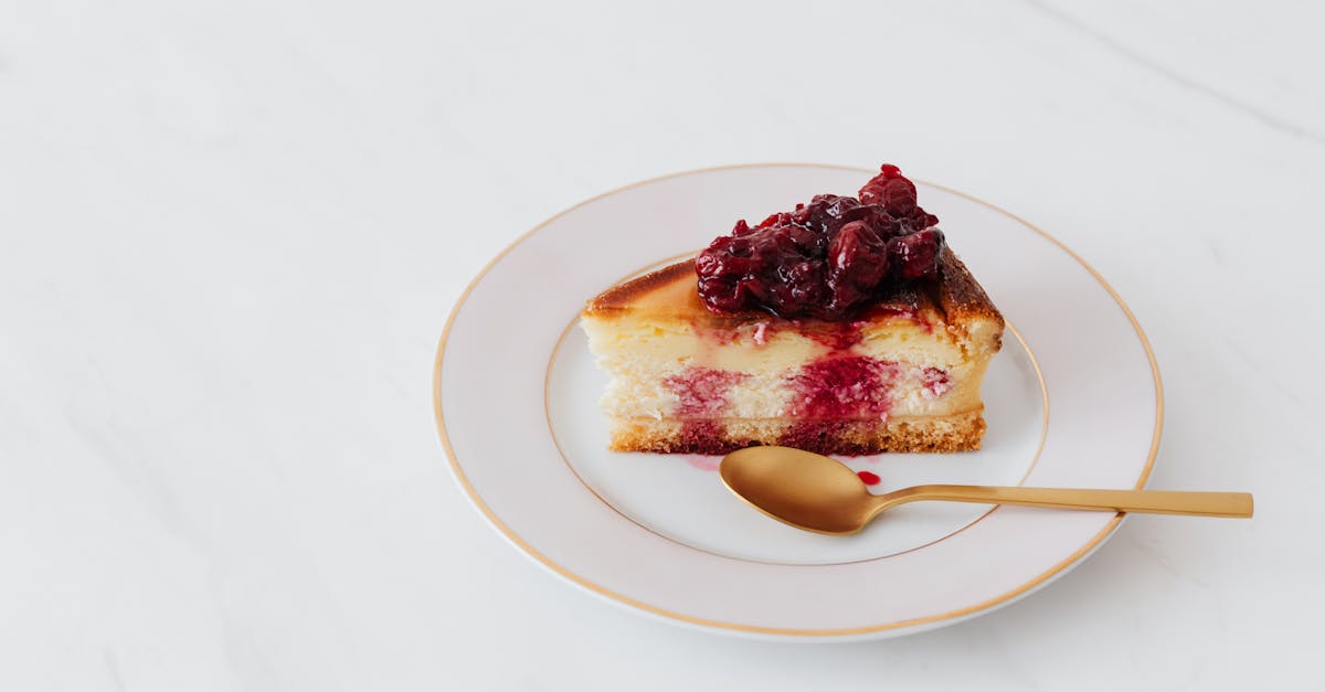 indulge in a slice of cheesecake topped with cherry compote elegantly served on a white plate 1