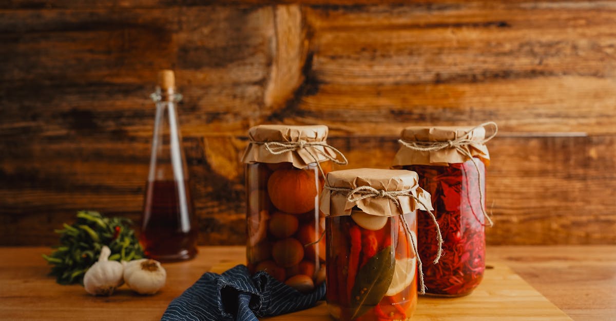 jars of preserved vegetables on a wooden surface with a rustic background 14
