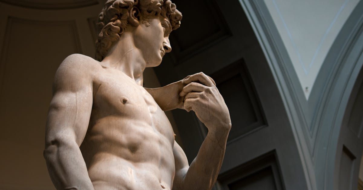 low angle view of michelangelo s statue of david showcasing its intricate details in florence museu