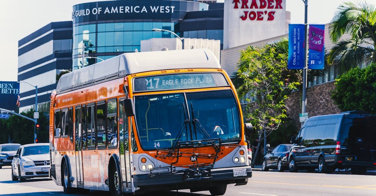 metro bus on eagle rock plaza route in los angeles passing iconic trader joe s on a sunny day