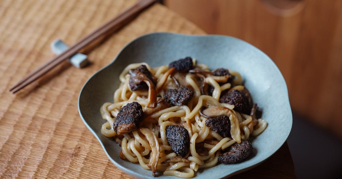 plate of udon noodles topped with rich black truffles perfect for a gourmet meal