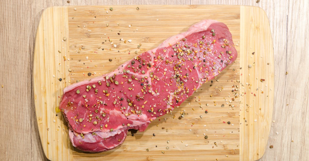 raw beef steak seasoned with spices on a wooden chopping board perfect for cooking enthusiasts 5