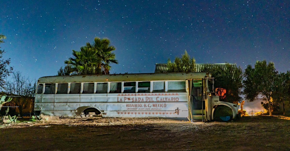 rusted bus sits abandoned under a starry sky in rosarito mexico captivating night scene